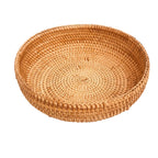 Hand-woven rattan storage basket in natural autumn vine, round shape with tapered edges, unpaintedHand-woven rattan storage basket in natural autumn vine, round shape with tapered edges, unpainted