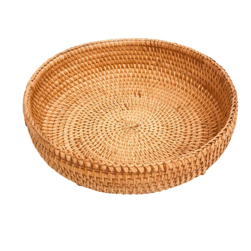 Hand-woven rattan storage basket in natural autumn vine, round shape with tapered edges, unpaintedHand-woven rattan storage basket in natural autumn vine, round shape with tapered edges, unpainted