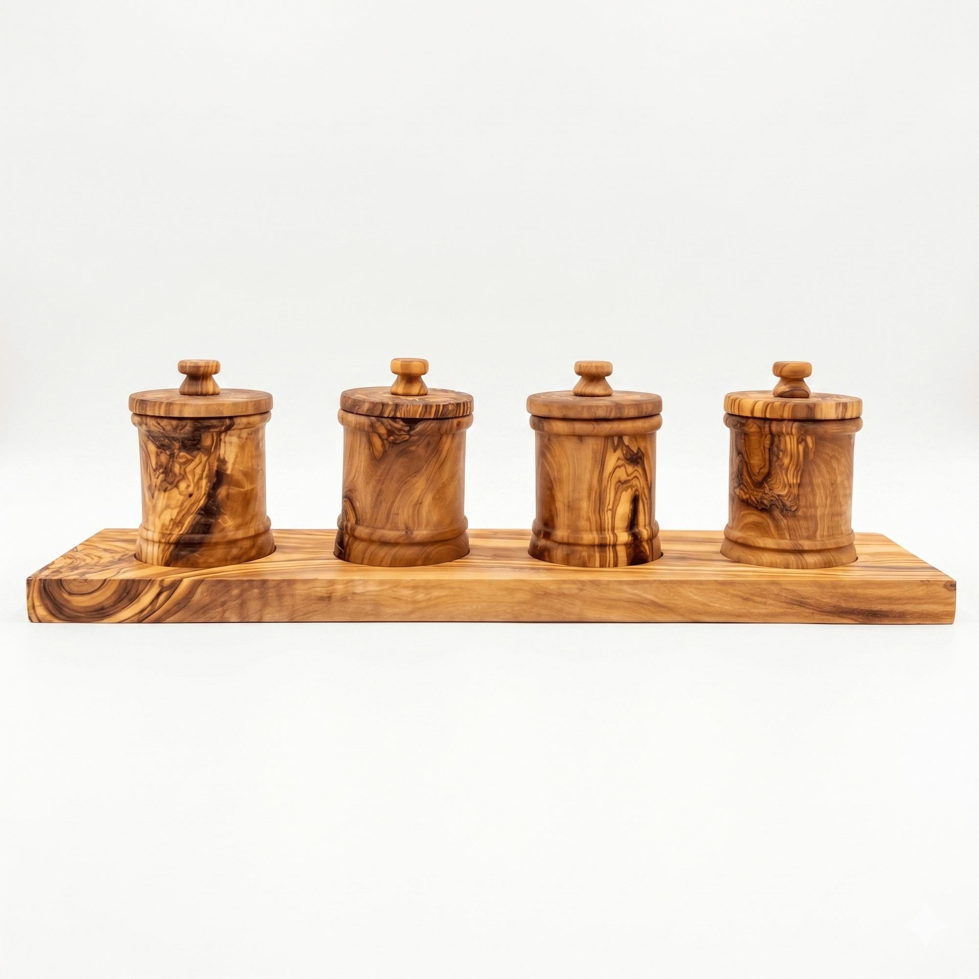 Four olive wood canisters on a long carved base for pantry storage.