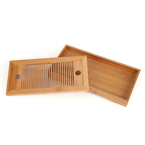 Bamboo tea tray with the slatted top lifted off the drip base