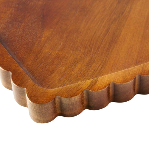 Close-up of the scalloped edge and rounded rim on an acacia heart serving tray — Serein Home