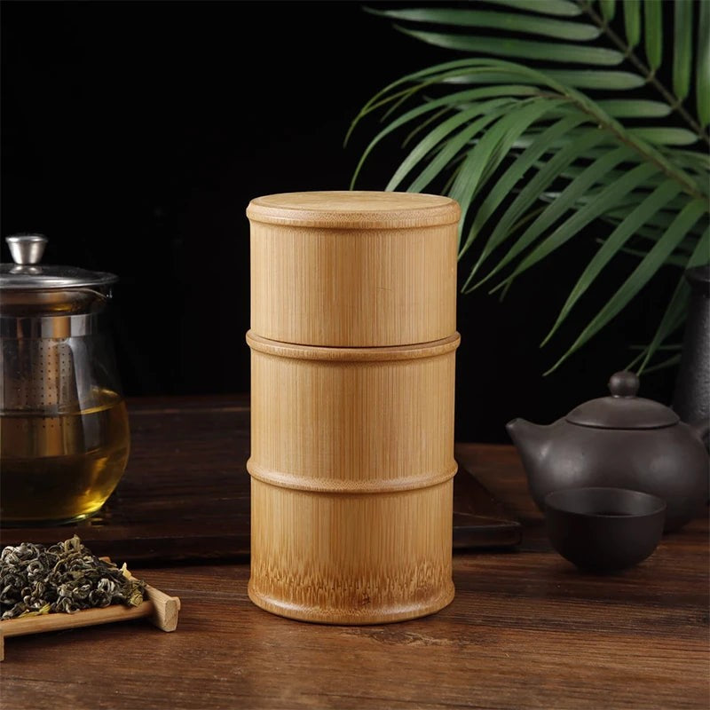 Medium bamboo tea canister, 15 cm tall with three bands, on a wood table with tea, Serein Home