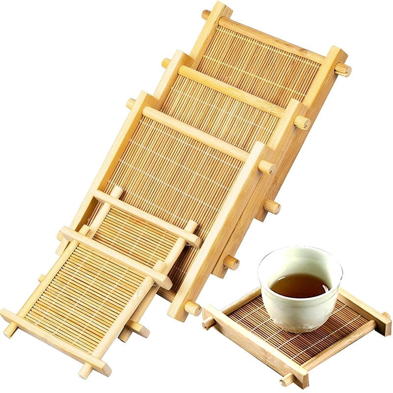 Four square bamboo tea coasters stacked, one holding a small cup of tea, on white, Serein Home