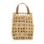 Close-up of the handwoven water hyacinth texture and faux leather strap join — Serein Home