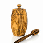 Handcrafted olive wood honey pot with honey dipper, natural grain pattern