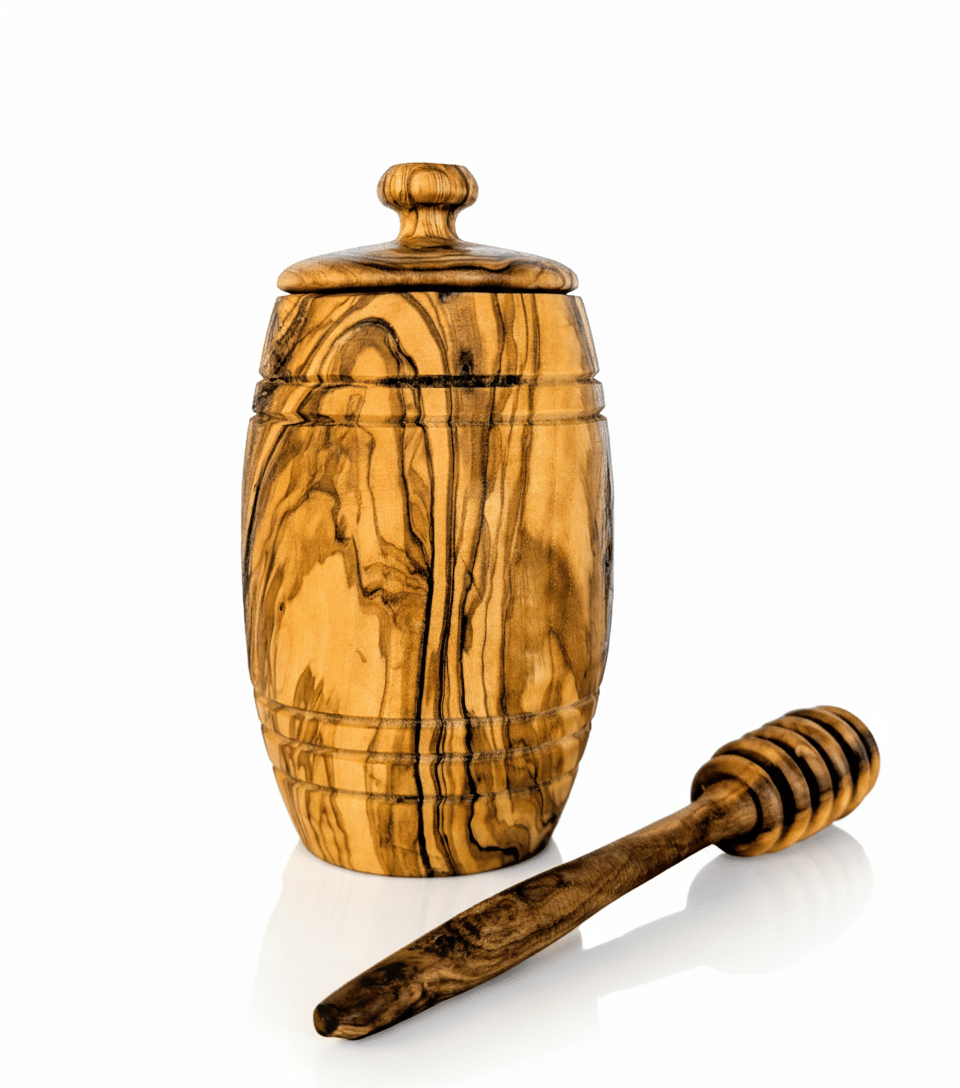Handcrafted olive wood honey pot with honey dipper, natural grain pattern