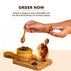 Olive wood honey pot with dipper on kitchen counter, rustic natural decor