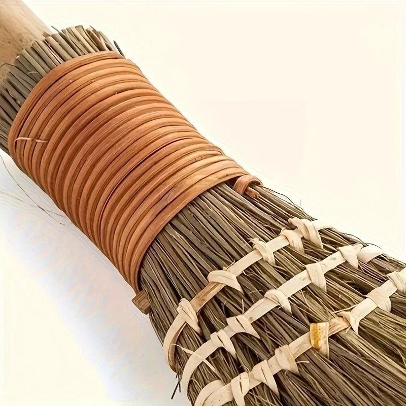 Detail of the cane wrapping and stitching on the grass broom handle