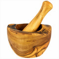 Wooden mortar and pestle on a white background
