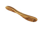 Close up of handcrafted olive wood butter spreader showing natural wood grain