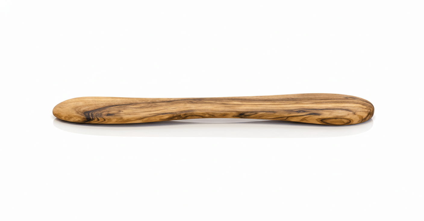 Close up of handcrafted olive wood butter spreader showing natural wood grain-2