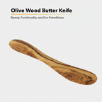 Eco friendly handmade olive wood kitchen utensil on natural linen background
