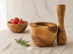 Olive wood mortar and pestle set for herbs, spices, and slow kitchen prep.