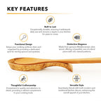 Rustic kitchen countertop with olive wood spoon rest and cooking utensils