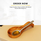 Cozy kitchen cooking scene with olive wood spoon rest and natural decor