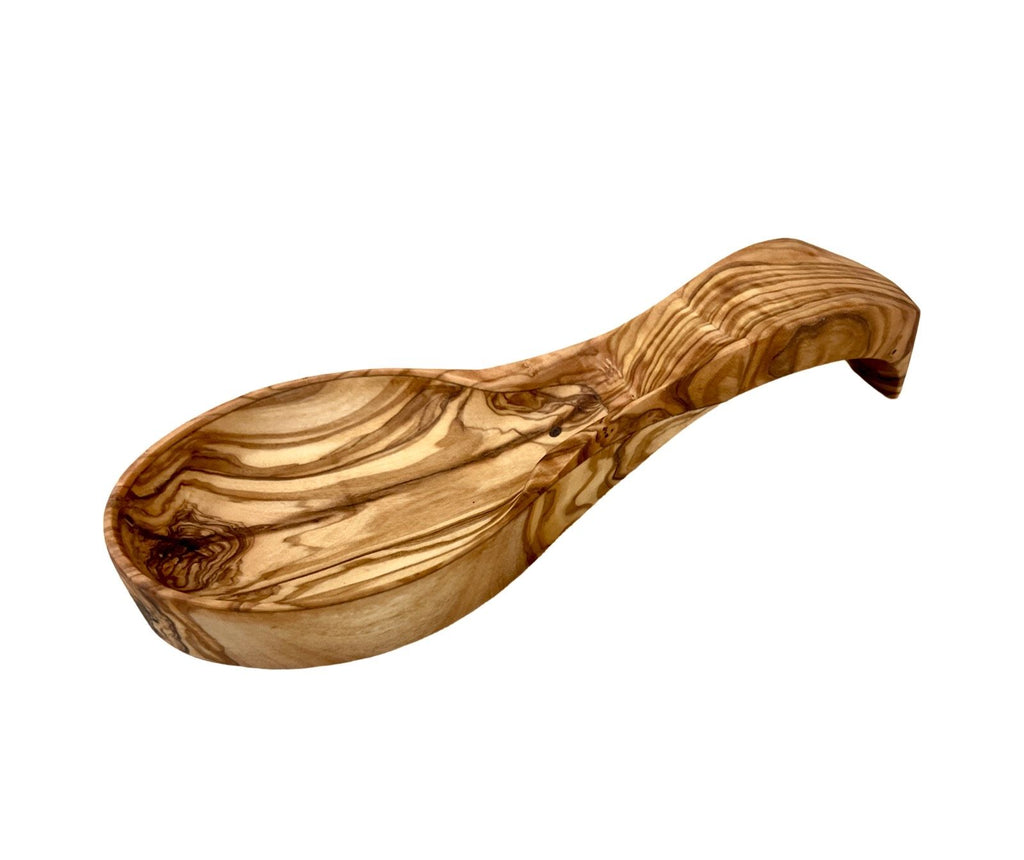 Top view of rustic olive wood spoon rest showing natural grain patterns
