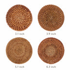 Set of 4 natural rattan coasters showing all four graduated sizes — 3.1 inch, 3.9 inch, 5.1 inch, and 6.3 inch