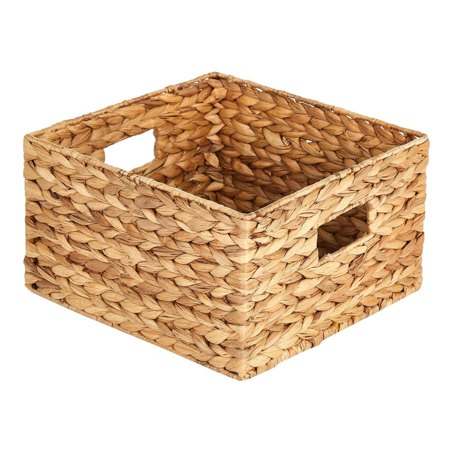Single woven water hyacinth storage basket with an open top and cutout handles