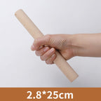 Hand holding the 25 centimetre wooden rolling pin