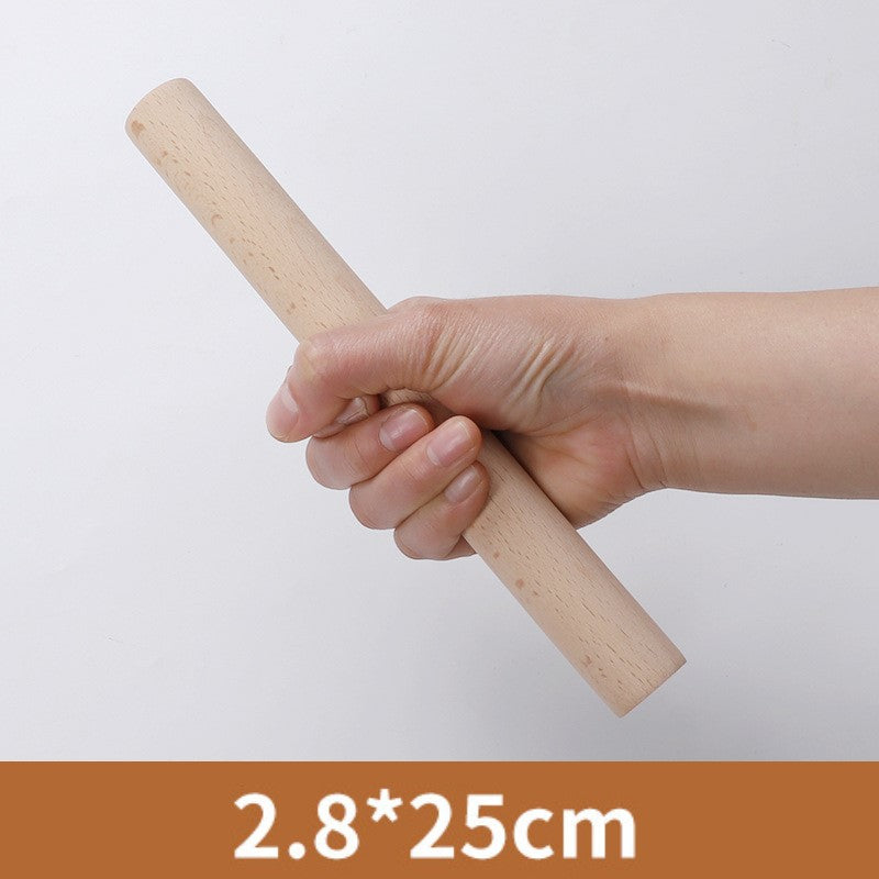 Hand holding the 25 centimetre wooden rolling pin