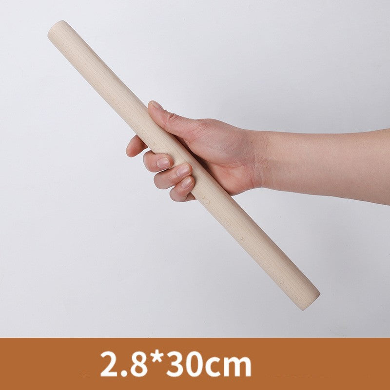 Hand holding the 30 centimetre wooden rolling pin