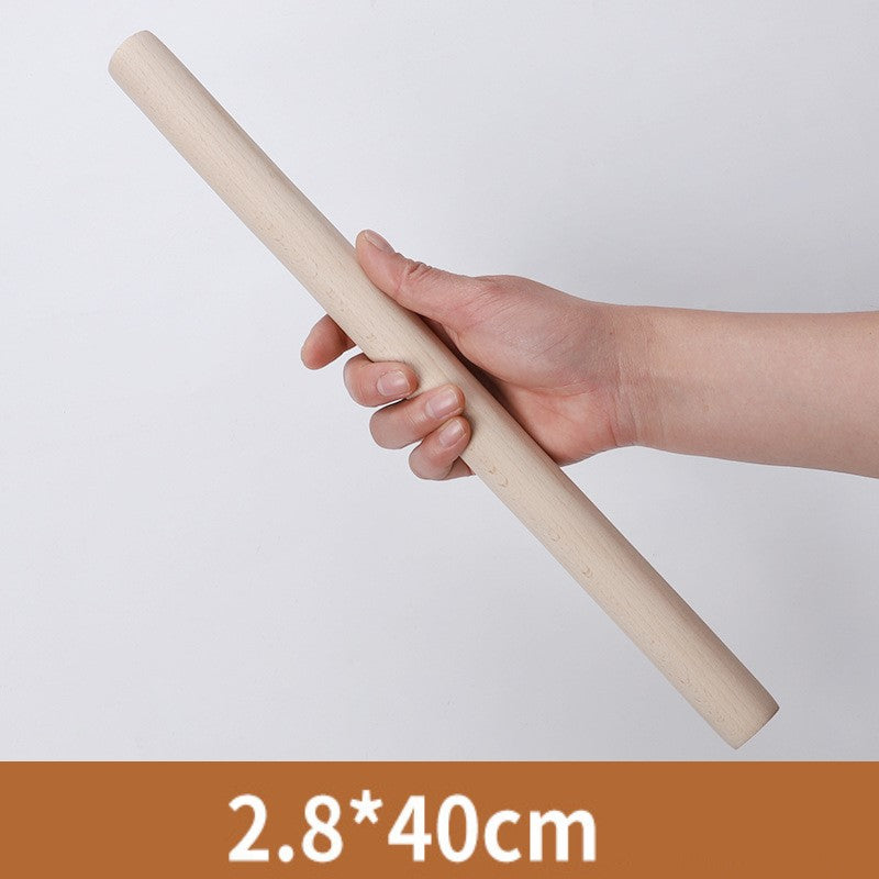 Hand holding the 40 centimetre wooden rolling pin
