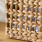 Close-up of water hyacinth open lattice weave texture — natural plant fiber, tan earthy tone, Serein Home