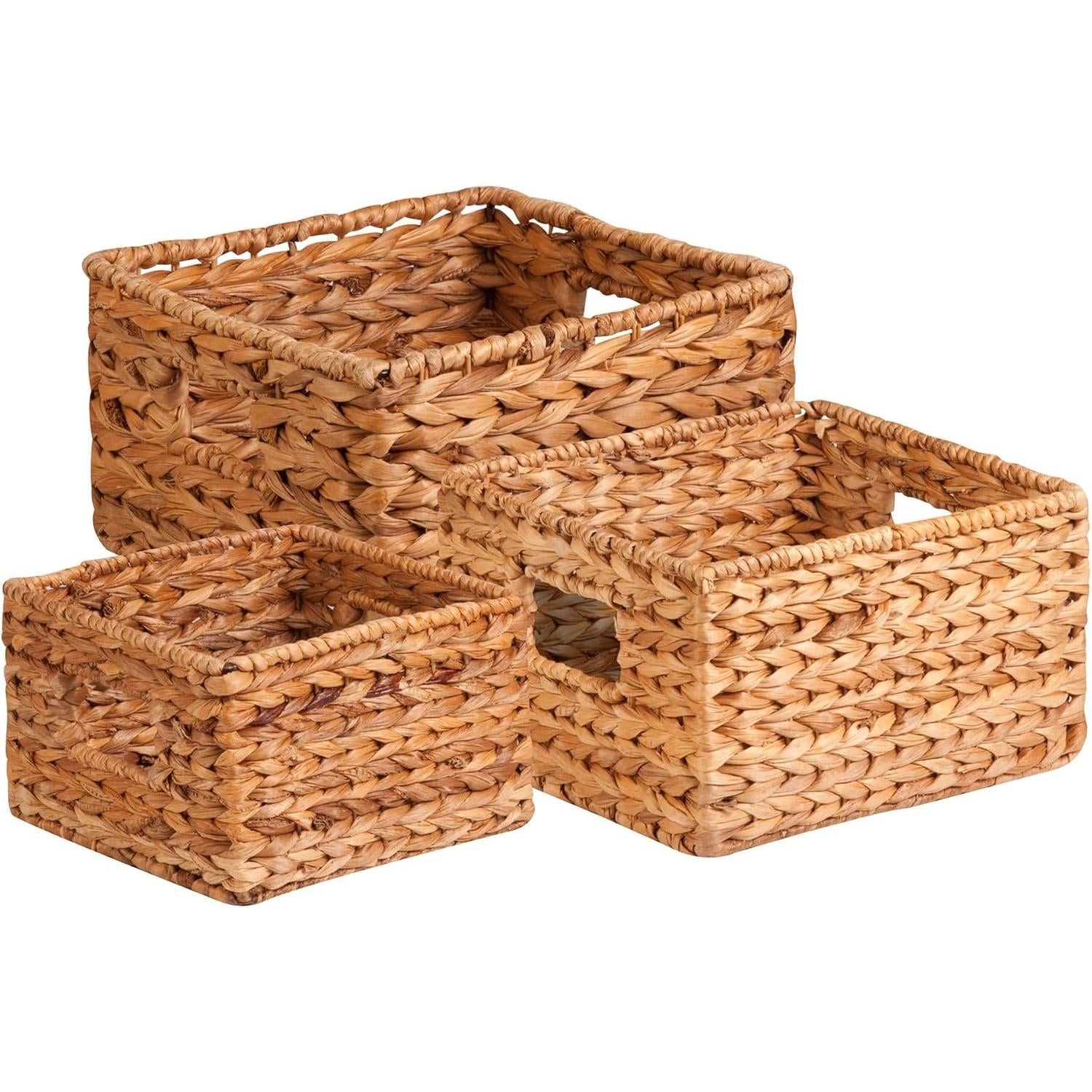 Set of 3 woven water hyacinth storage baskets in graduated sizes, natural finish, white background