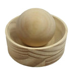 Wooden dumpling press cup with its wooden ball resting inside, on a plain white background, Serein Home
