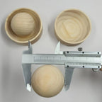 Wooden press ball measured with a steel caliper beside two empty wooden press cups, Serein Home