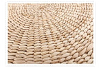 Macro of tightly coiled natural straw on a woven floor cushion, Serein Home