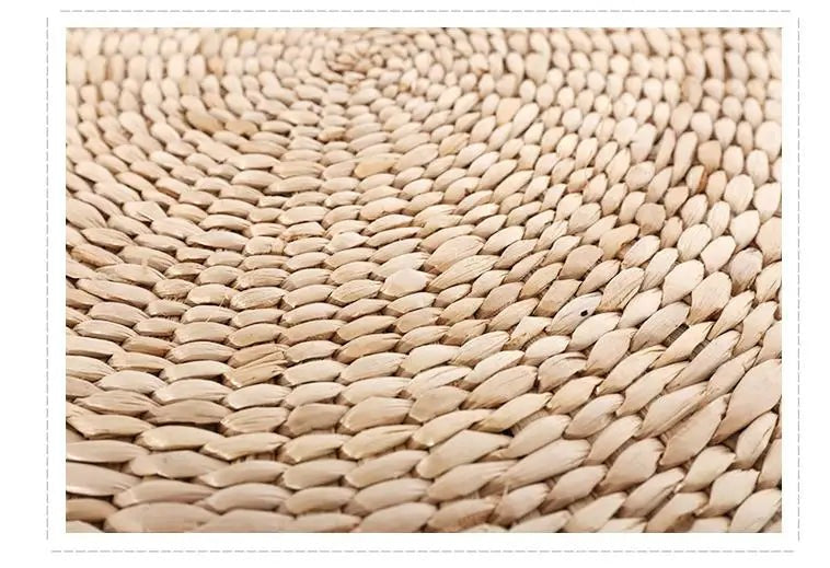 Macro of tightly coiled natural straw on a woven floor cushion, Serein Home