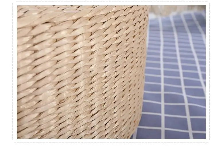 Side view of the woven straw edge of a round floor cushion, Serein Home